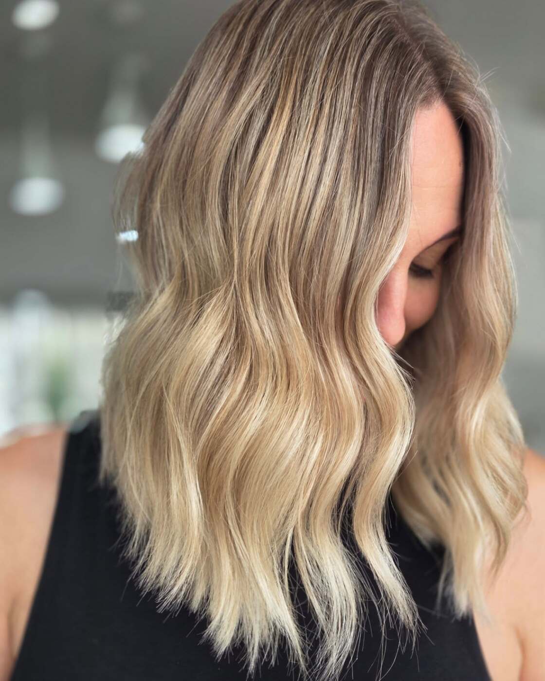 Blonde balayage waves seen from the side