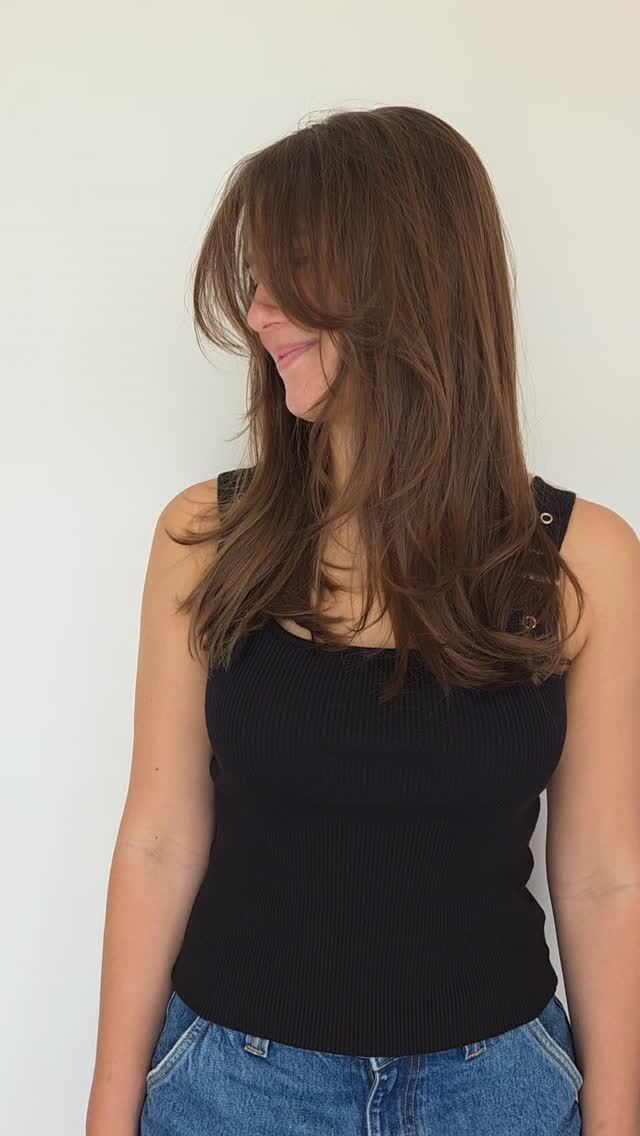 Long brunette layers with a fringe