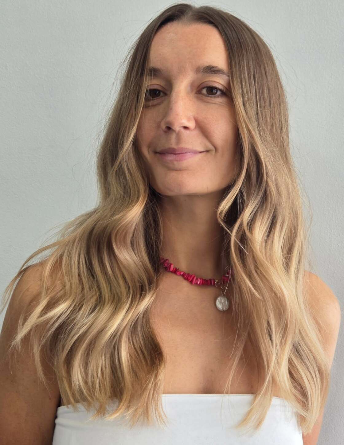 Long blonde lived-in colour with a centre part