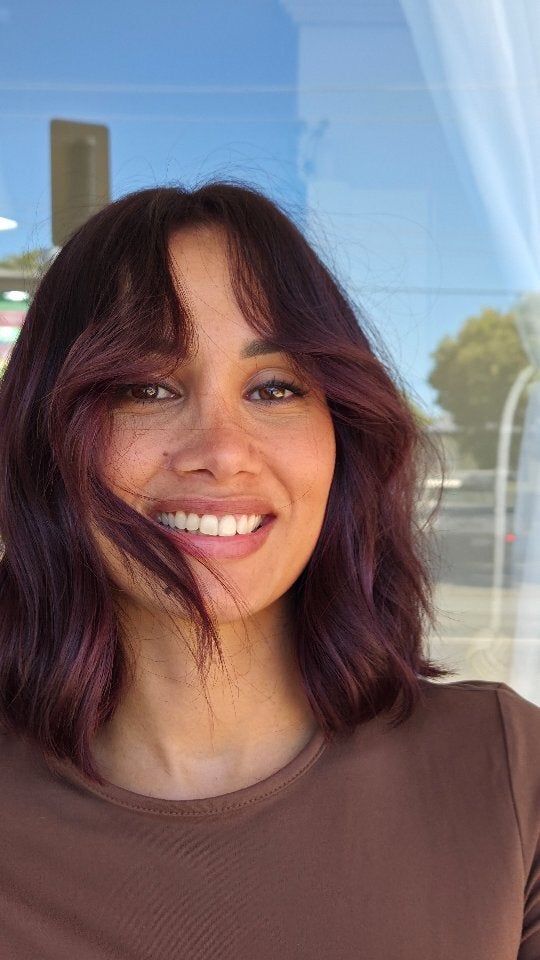 Deep plum brunette with a fringe