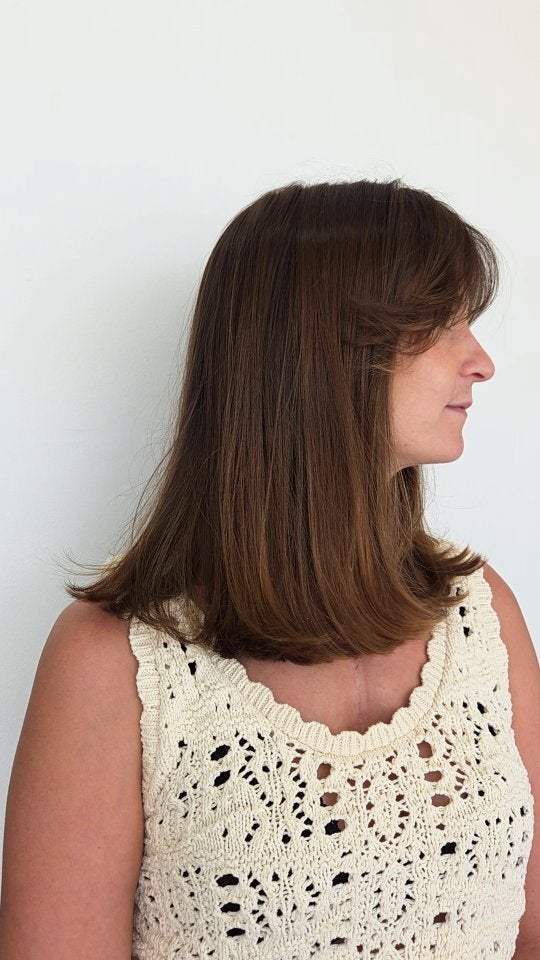 Brunette lob with a fringe, in profile