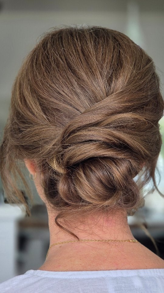 Low twisted chignon for an event